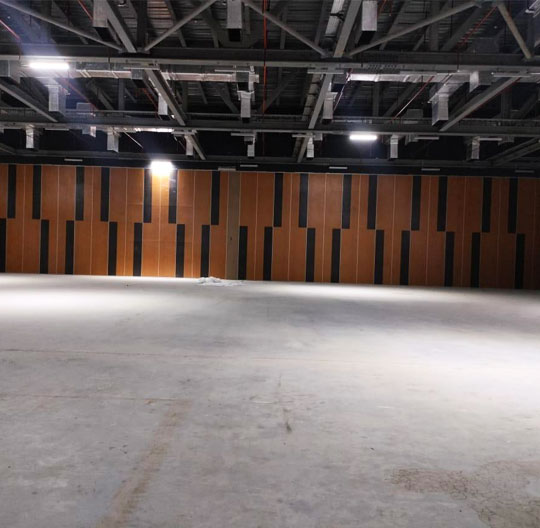 Acoustic wall partition installed in auditorium for echo control and sound management